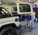 TopLift Pro V2 hardtop removal and storage tool for Jeep Wrangler and Ford Bronco by Top Lift Pros Sandbox, shown in use.