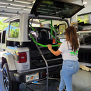 TopLift Pro V2 hardtop removal and storage tool for Jeep Wrangler and Ford Bronco, shown in use.