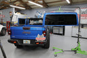 TopLift Pros Gladiator Pro hardtop removal and storage tool for Jeep Gladiator, shown in use with the hardtop lifted.